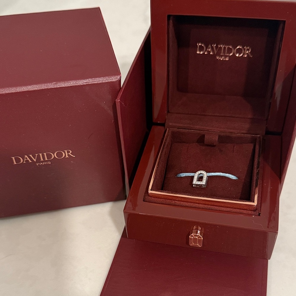 L’Arc voyage charm PM 18k white gold with galerie diamonds on silk cord bracelet